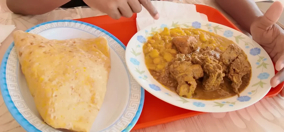 Dhalpuri roti with curry chicken, curried potato and channa