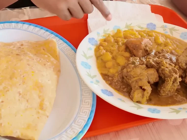 Dhalpuri roti with curry chicken, curried potato and channa