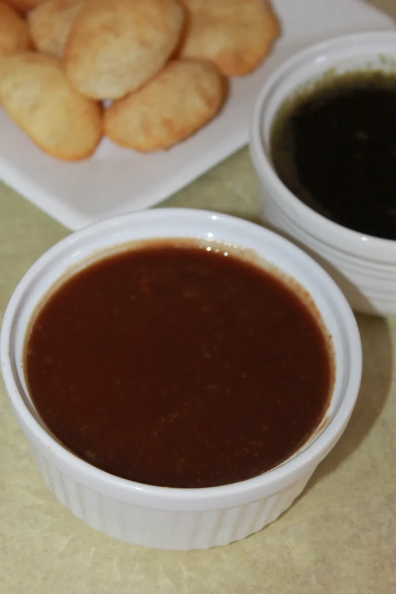 A bowl of dark, glossy tamarind chutney